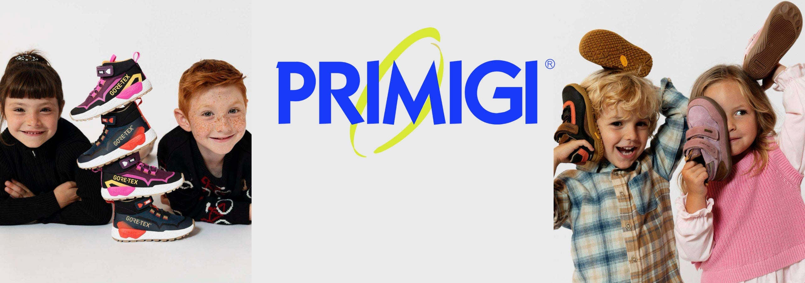 A promotional banner for PRIMIGI children's shoes, featuring the blue and yellow PRIMIGI logo in the center, flanked by children modeling colorful athletic shoes. The background is a clean white studio backdrop.